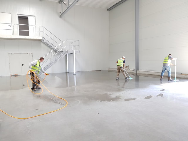 Our commercial concrete contractors giving the freshly renovated concrete surface a wipe.